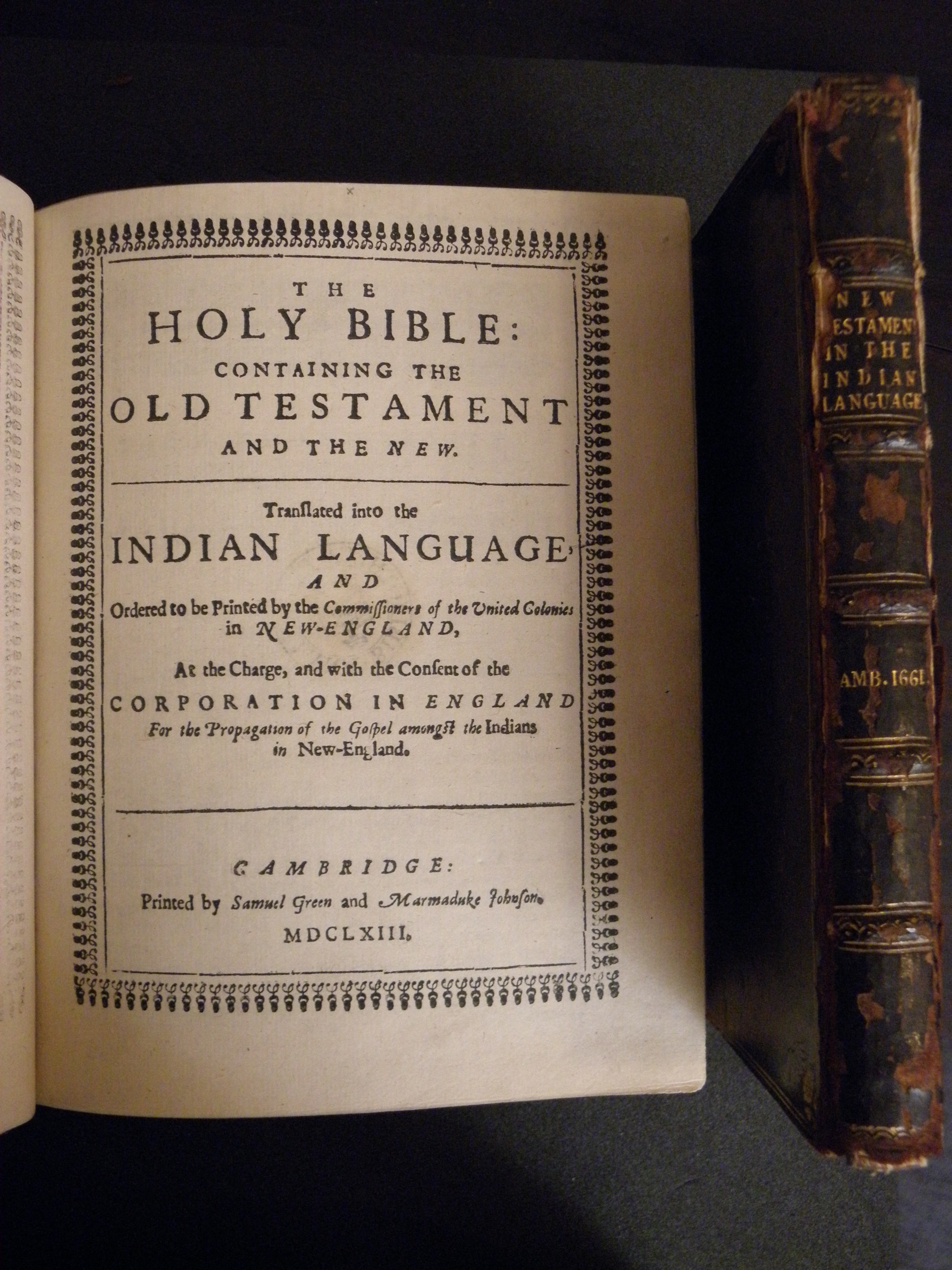 Title page of John Eliot's The Holy Bible: Containing the Old Testament and the New and the spine of his New Testament translation into the Algonquin language. (A 1663 .B53 and A 1661 .B52, respectively. Tracy W. McGregor Library of American History. Photograph by Donna Stapley)
