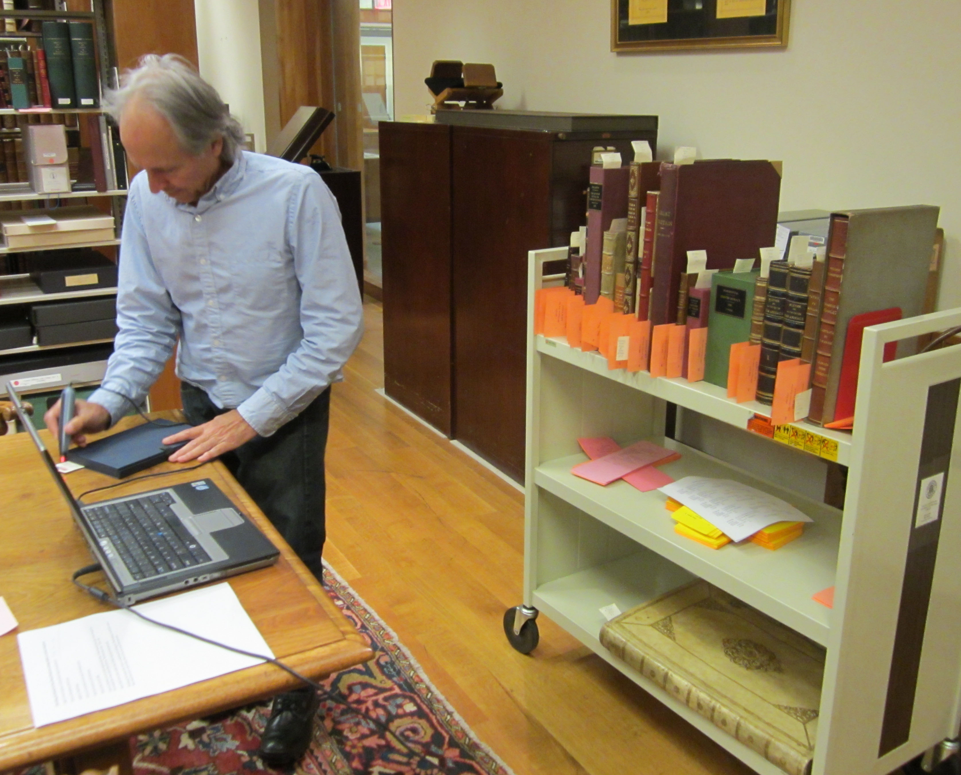 George Riser checks out Special Collections books for RBS.(Photograph by Petrina Jackson)