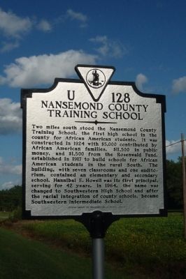 photo of historic marker against a bright blue sky