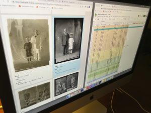 A computer screen showing digitized plates with metadata fields in one window juxtaposed with a color-coded spreadsheet in another.